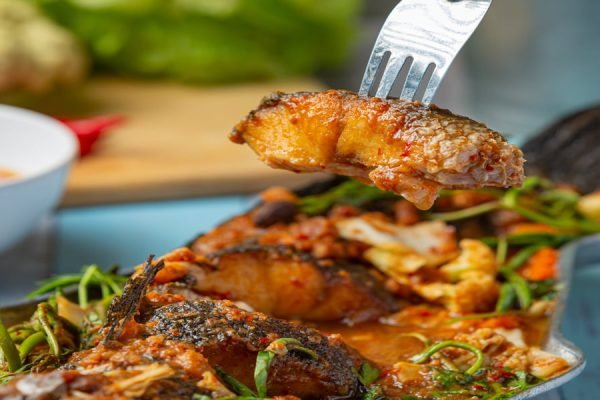 Sour curry with snakehead fish, spicy garden hot pot, Thai food. call catering